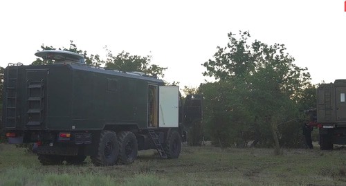 Спецтехника во время проведения  КТО силовиками в лесу неподалеку от села Талги. Кадр видео Национальный антитеррористический комитет